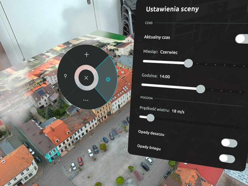 Fotomontaż składa się ze zdjęcia fragmentu zabudowy miejskiej z lotu ptaka, oraz interaktywnego panelu zatytułowanego „ustawienia sceny”. Na panelu znajdują się między innymi aktualny czas, miesiąc, godzina, a także pogoda, opady deszczu i śniegu. Wszystkie wartości można uruchamiać za pomocą suwaków. Grafika pochodzi z archiwum beneficjenta.