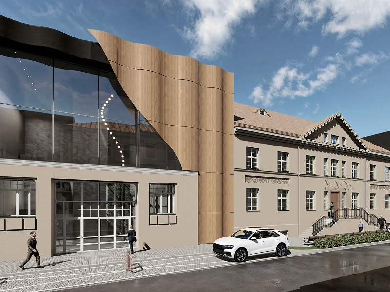 Wizualizacja przedstawia nowoczesny, częściowo przeszklony budynek, ze sporym falistym elementem, położony przy drodze. Materiały pochodzą z archiwum beneficjenta.